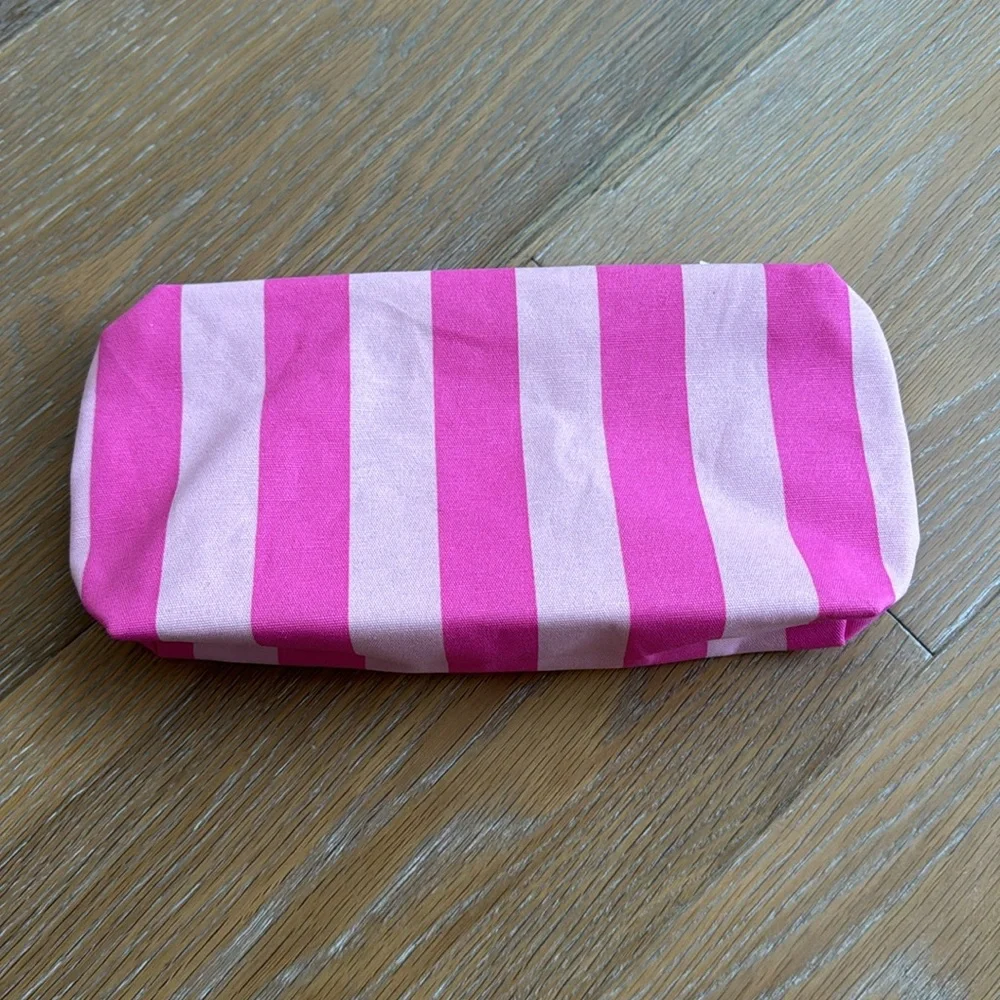 Estée Lauder pink zippered cosmetic bag with sea creatures and tropical trees